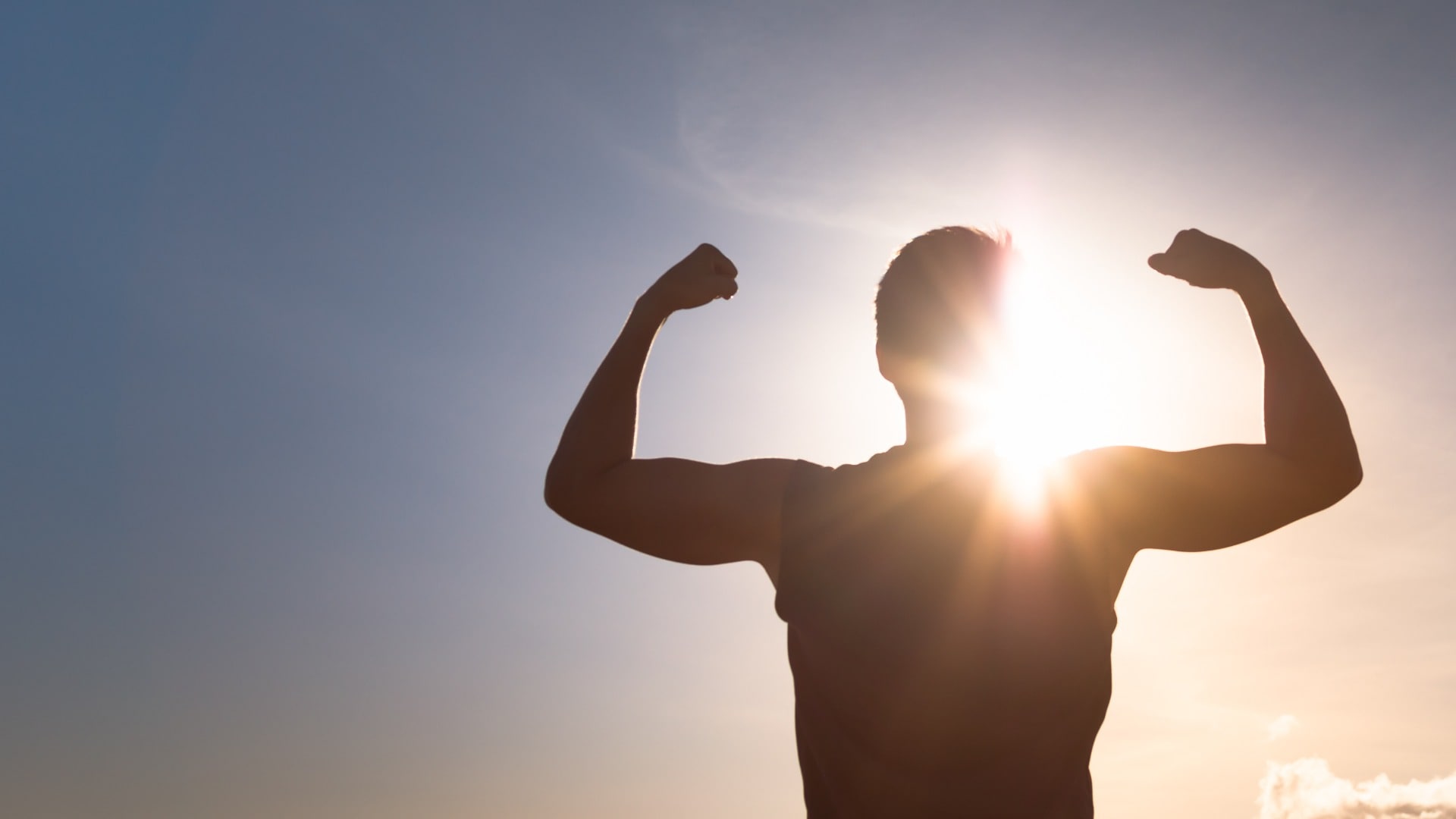 Strong man flexing silhouette. People health and fitness