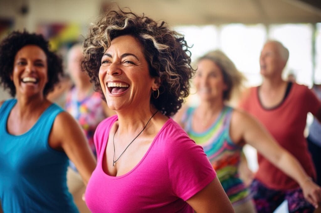 Women enjoying zumba dance class.